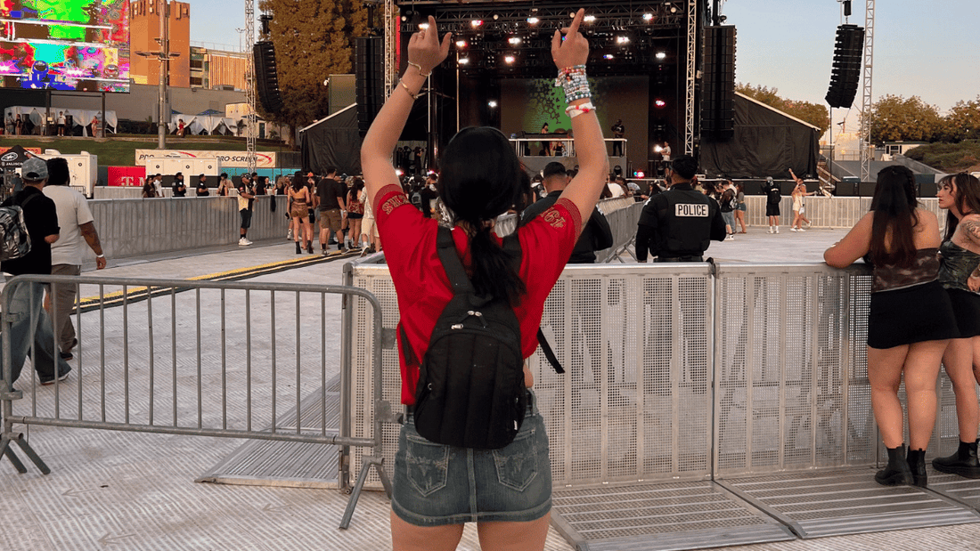 Woman with hauter festival hydration backpack at outdoor festival
