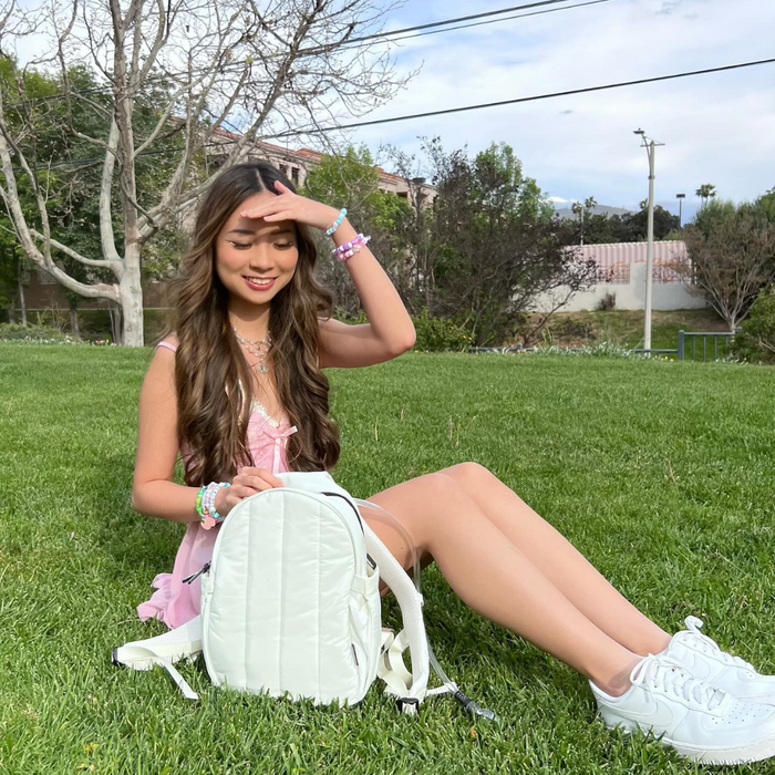 woman with a hydration backpack in the park
